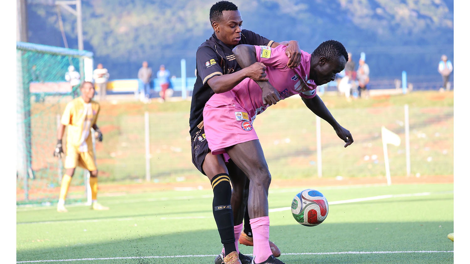 Mbabane Swallows skipper Mandla Palma tries hard to protect his ball while Highlanders' Zwelihle Phewa hoped to breakthrough. Highlanders won the match 1-0.